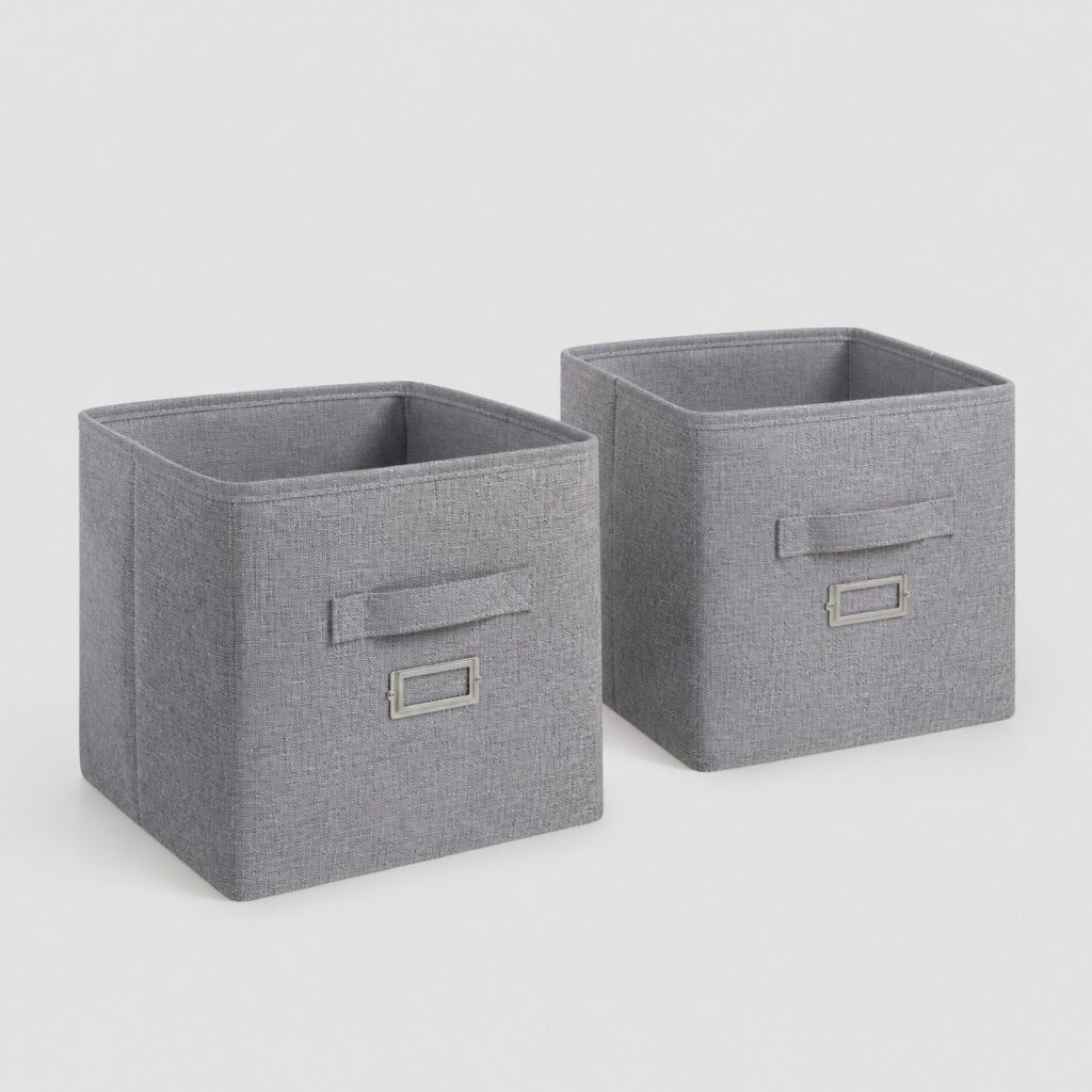 Deux paniers souples en tissu gris chiné sur fond gris clair